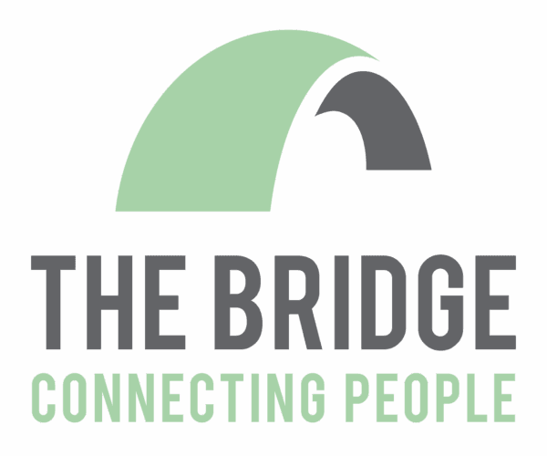 Logo with a green and grey bridge graphic, text reads "THE BRIDGE CONNECTING PEOPLE. - Home Instead
