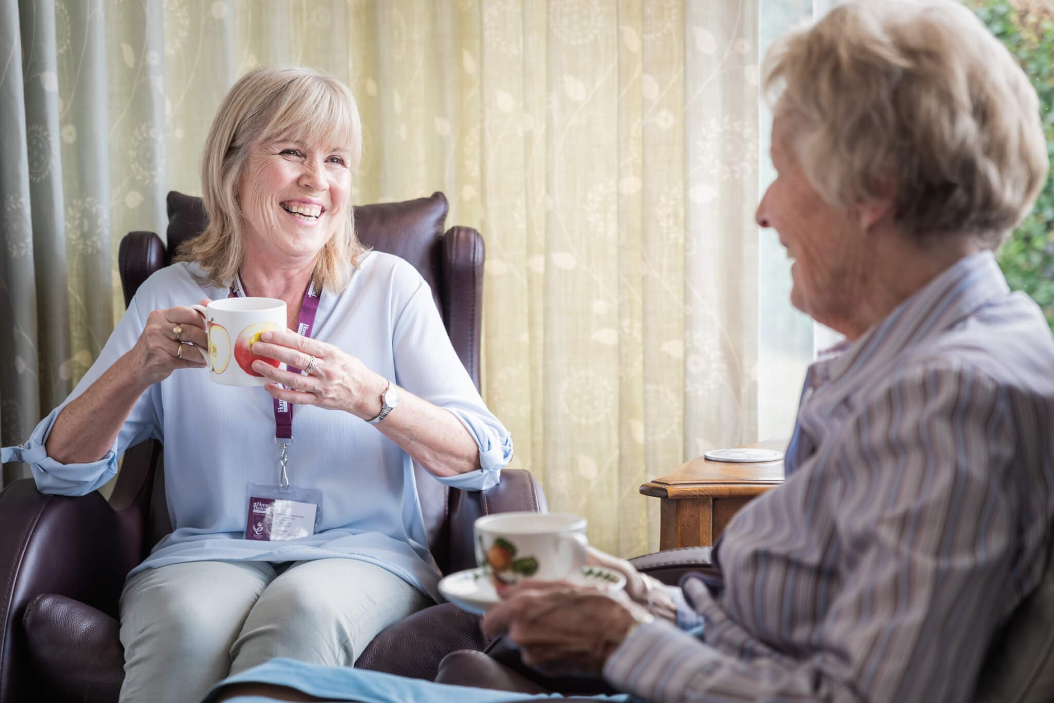 Caregiver from Home Instead Stourbridge Hagley Halesowen Belbroughton Clent and Romsley enjoying a cup of tea with client