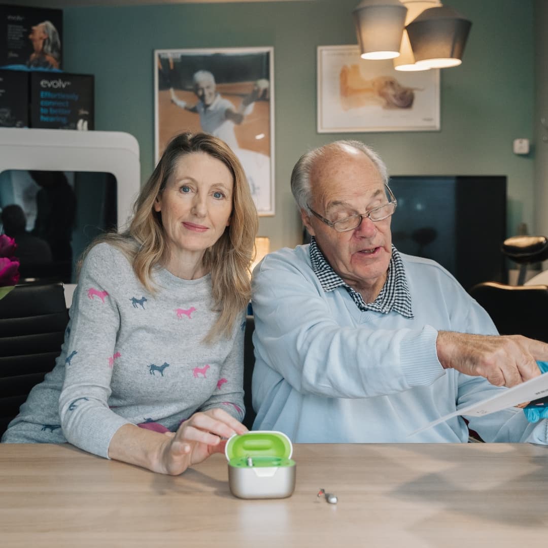 Father and Daughter having a discussion at a table
