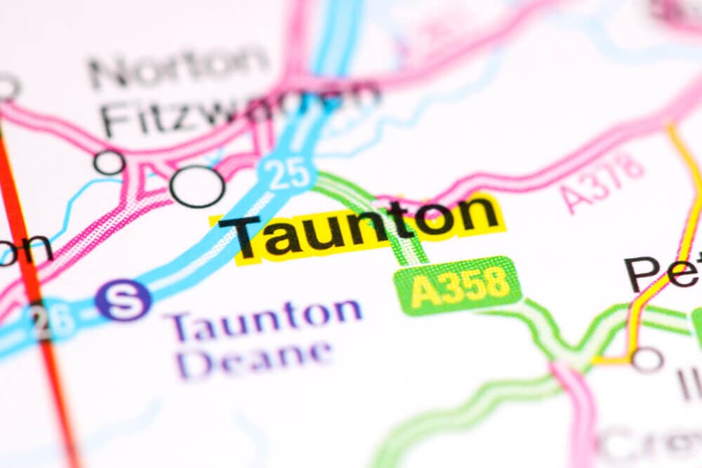 Close-up of a map highlighting Taunton, with nearby roads A358, A37, and landmarks like Norton Fitzwarren and Taunton Deane. - Home Instead