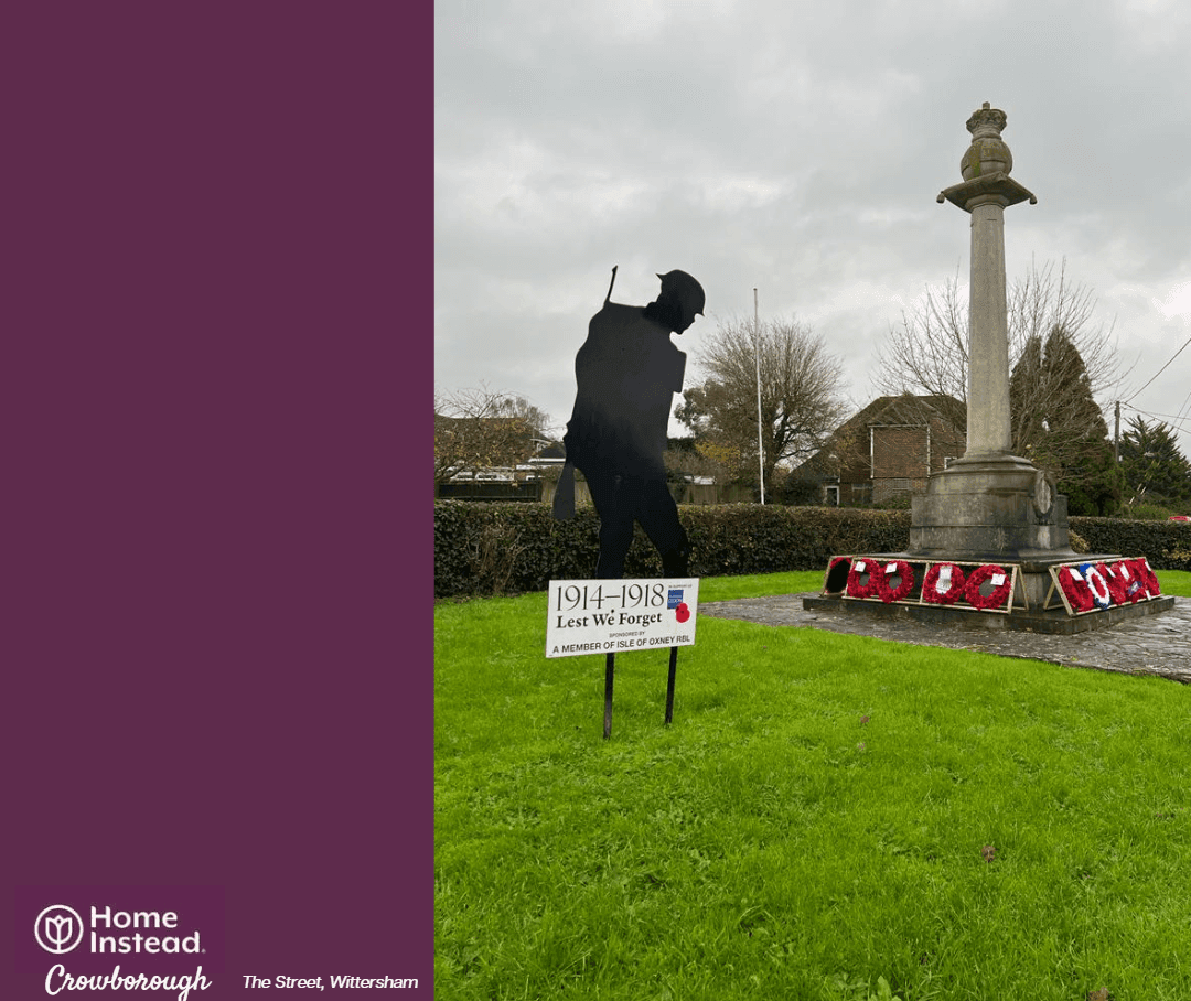 Silhouette soldier statue beside war memorial with wreaths in Wittersham. Text: Home Instead Crowborough, The Street, Wittersham. - Home Instead