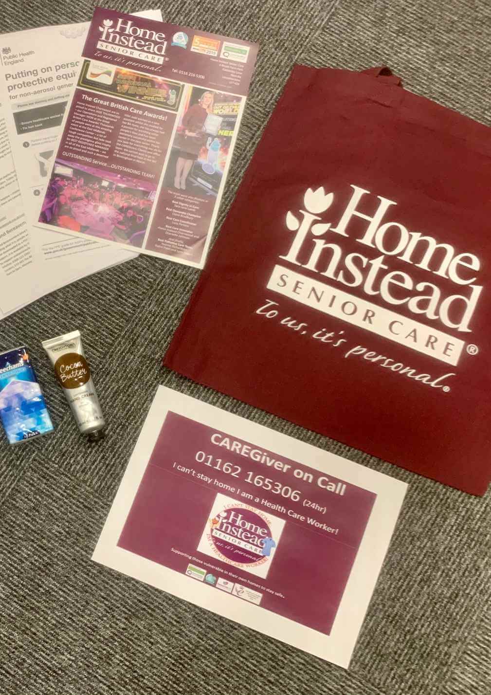 Home Instead Senior Care tote bag with brochures, hand cream, sanitizer, and a flyer with contact information. - Home Instead