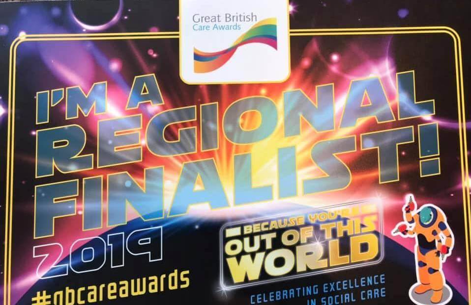 Sign for the Great British Care Awards 2019 stating "I'm a Regional Finalist!" with a space-themed design. - Home Instead