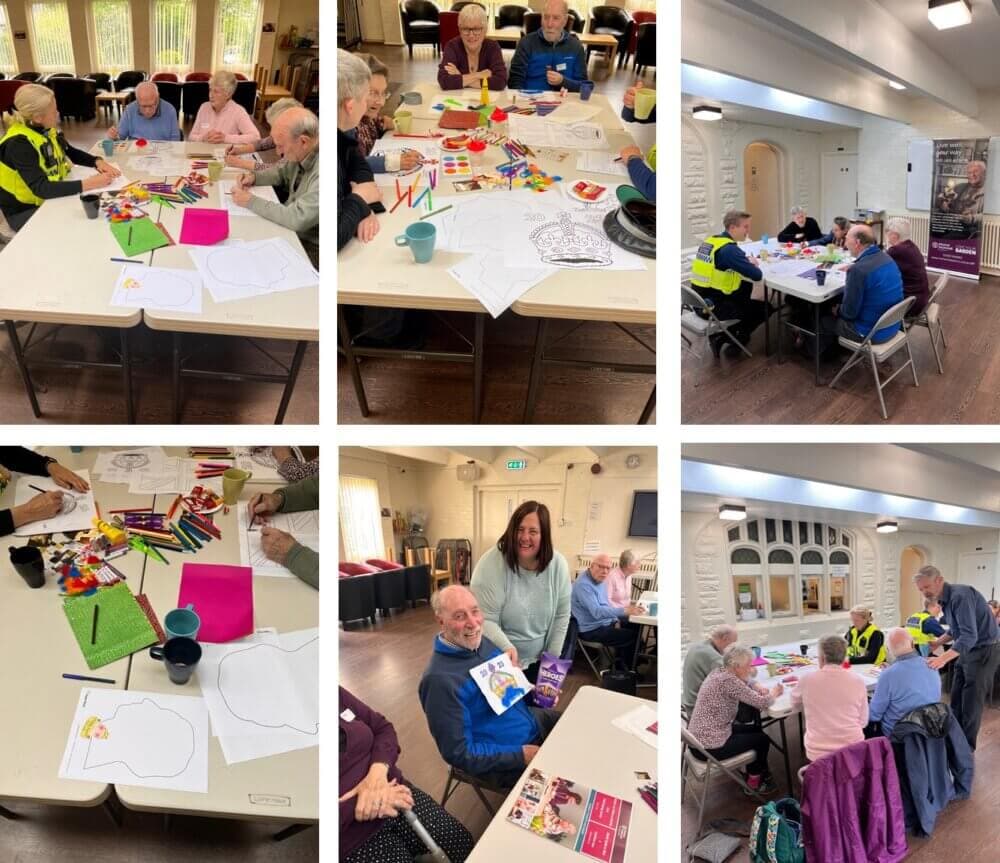 Seniors seated at tables in a community hall doing art and craft activities, accompanied by staff. - Home Instead