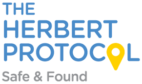 The Herbert Protocol logo with tagline 'Safe & Found' and a yellow location pin icon. - Home Instead