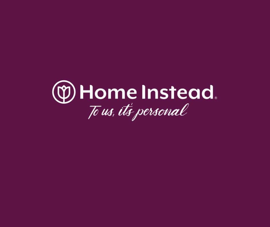 Logo of Home Instead with the text "To us, it's personal" on a purple background. - Home Instead