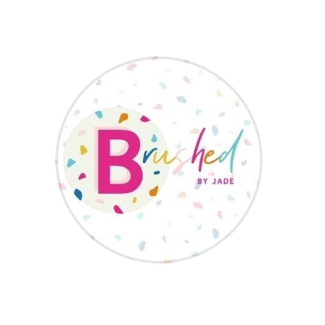 Logo with a large pink "B" and colorful confetti. Text reads "Brushed by Jade" in a mix of blue, pink, and green. - Home Instead