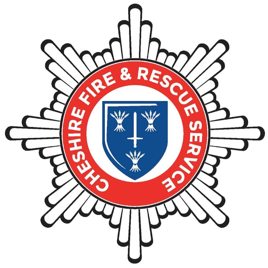 Cheshire Fire & Rescue Service logo featuring a blue shield with a white cross and three sheafs, inside a red circle. - Home Instead