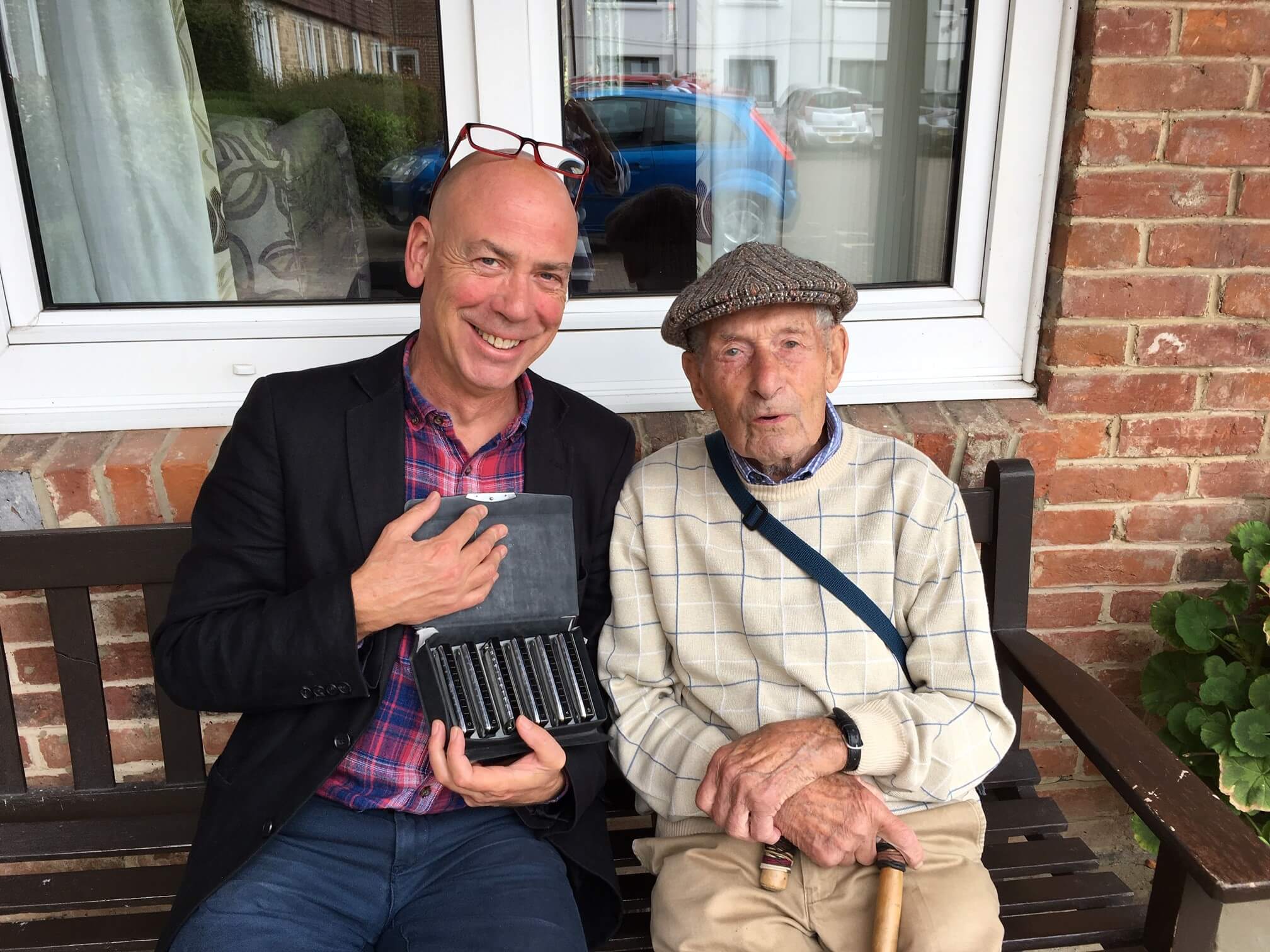 Caregiver Michael and Bill playing music together