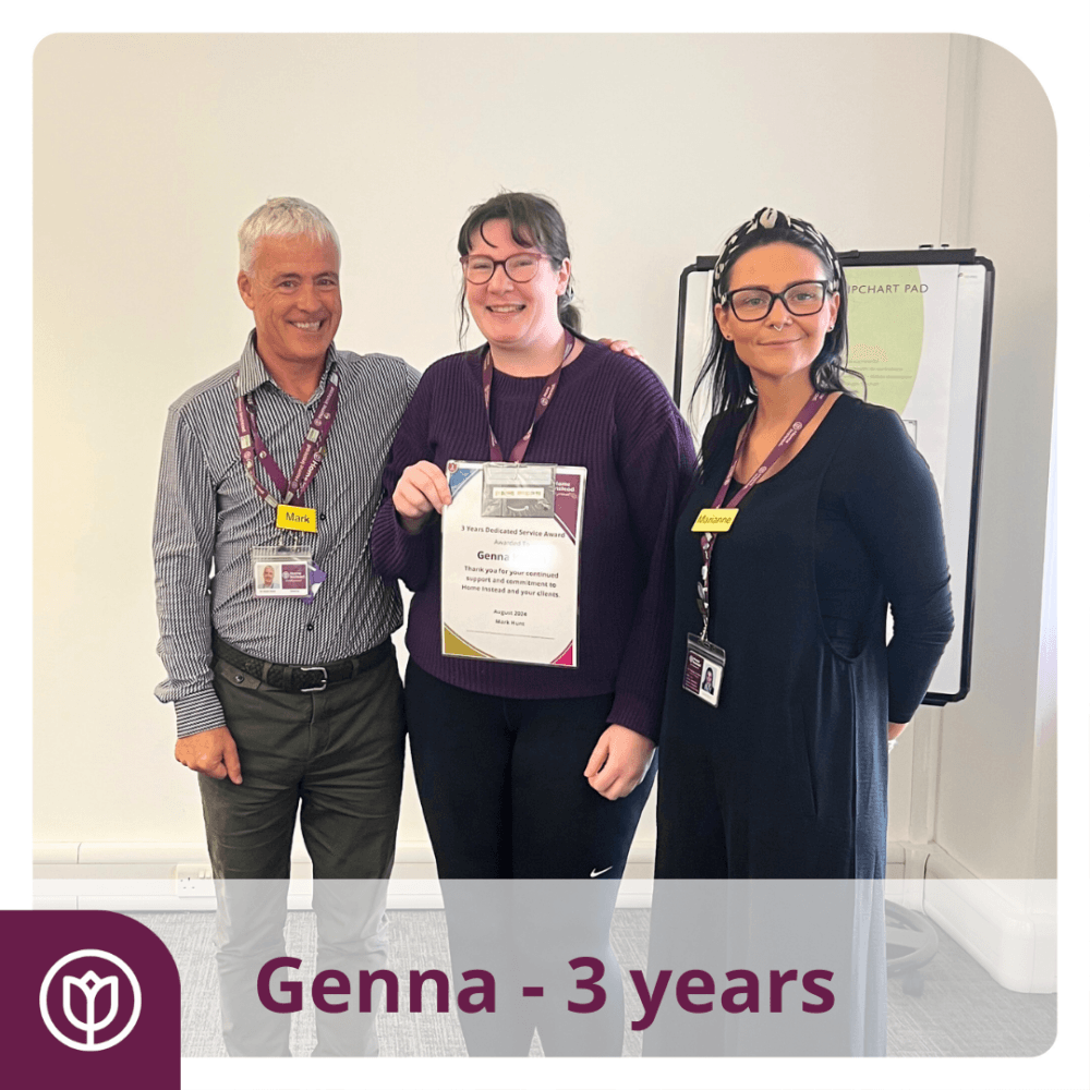 care pro with director Mark and Manager Marianne after receiving her work anniversary award