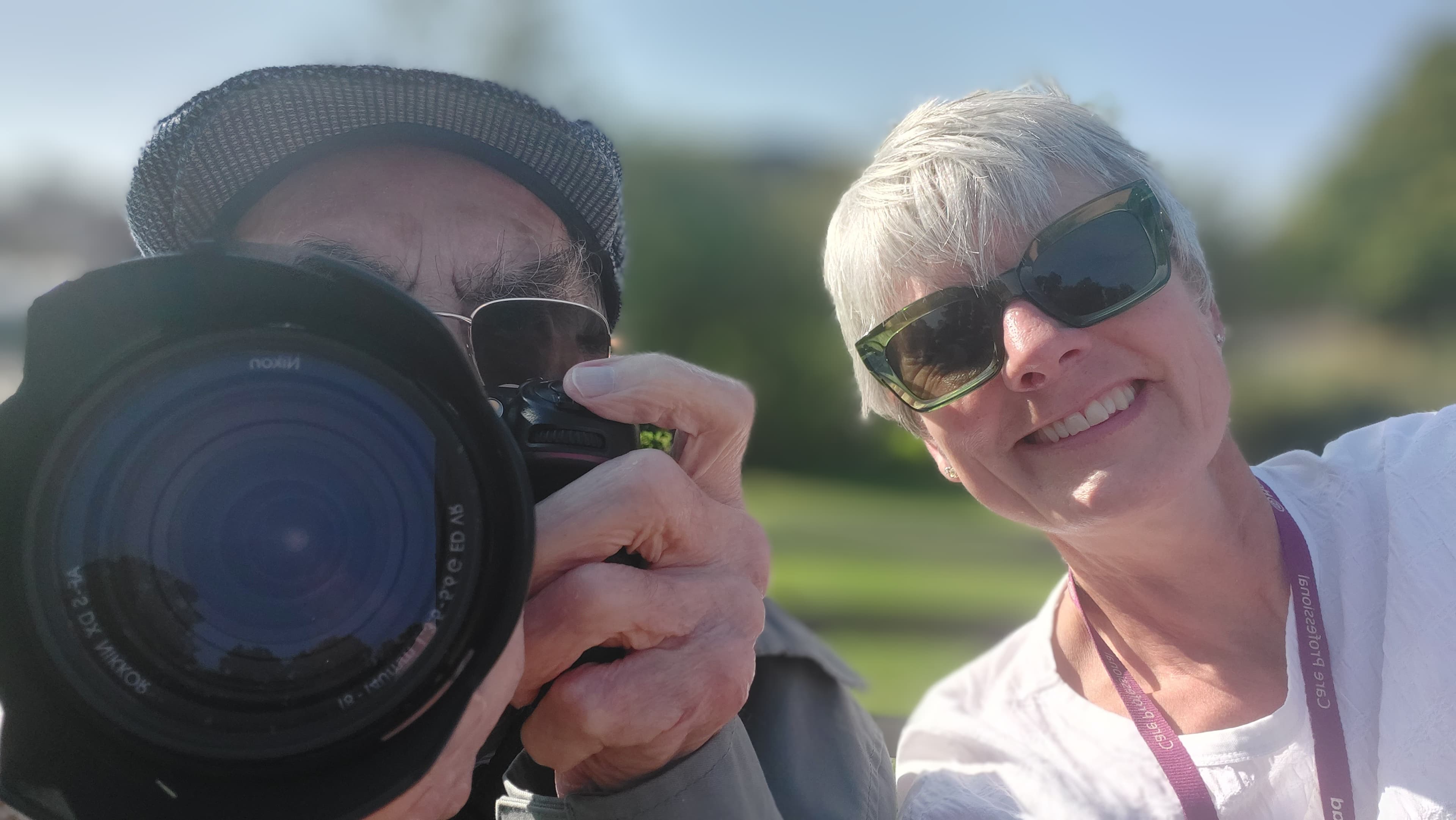 Care Professional and Client smiling, holding a camera