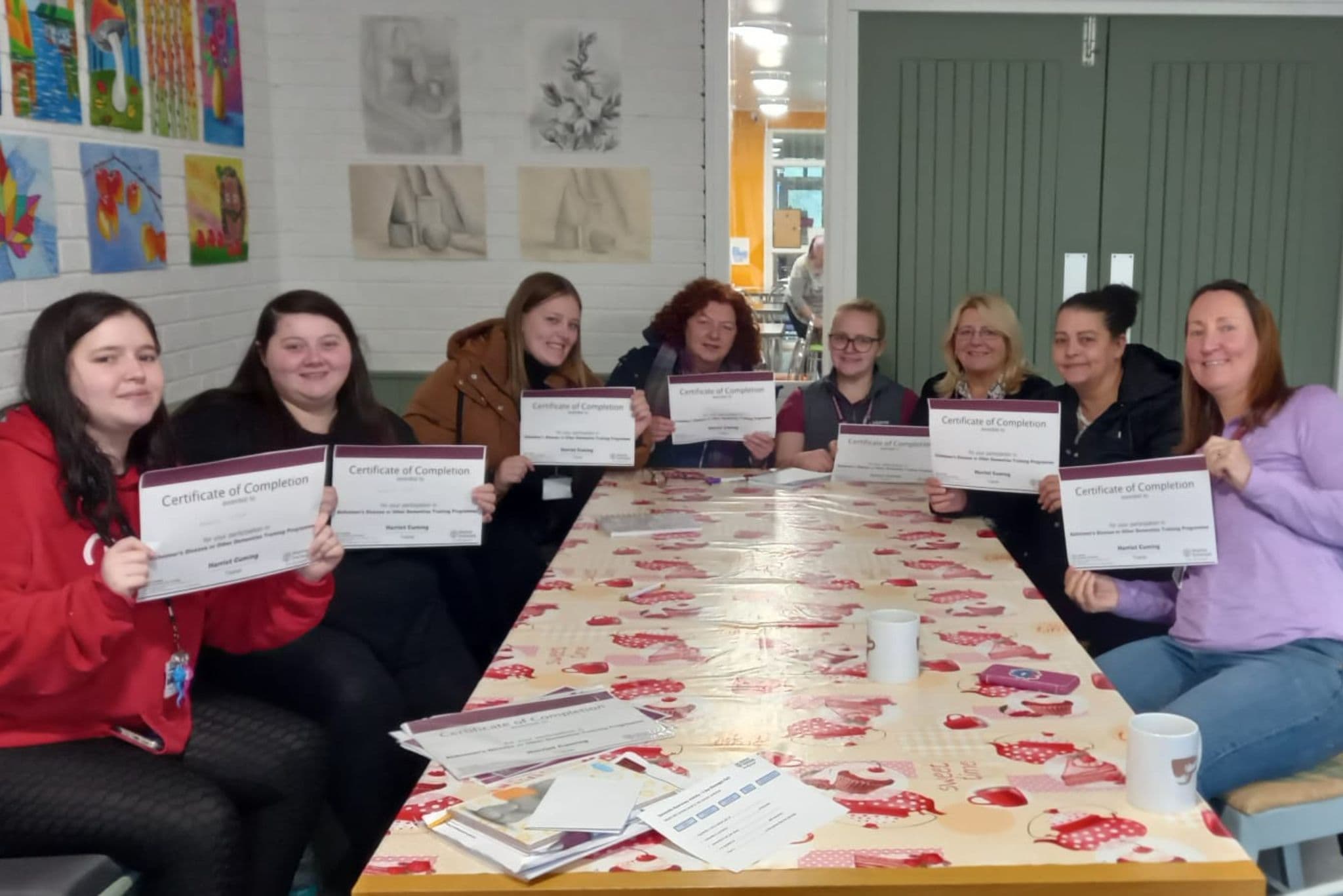 Individuals who completed Dementia Awareness Training presenting their certificates.
