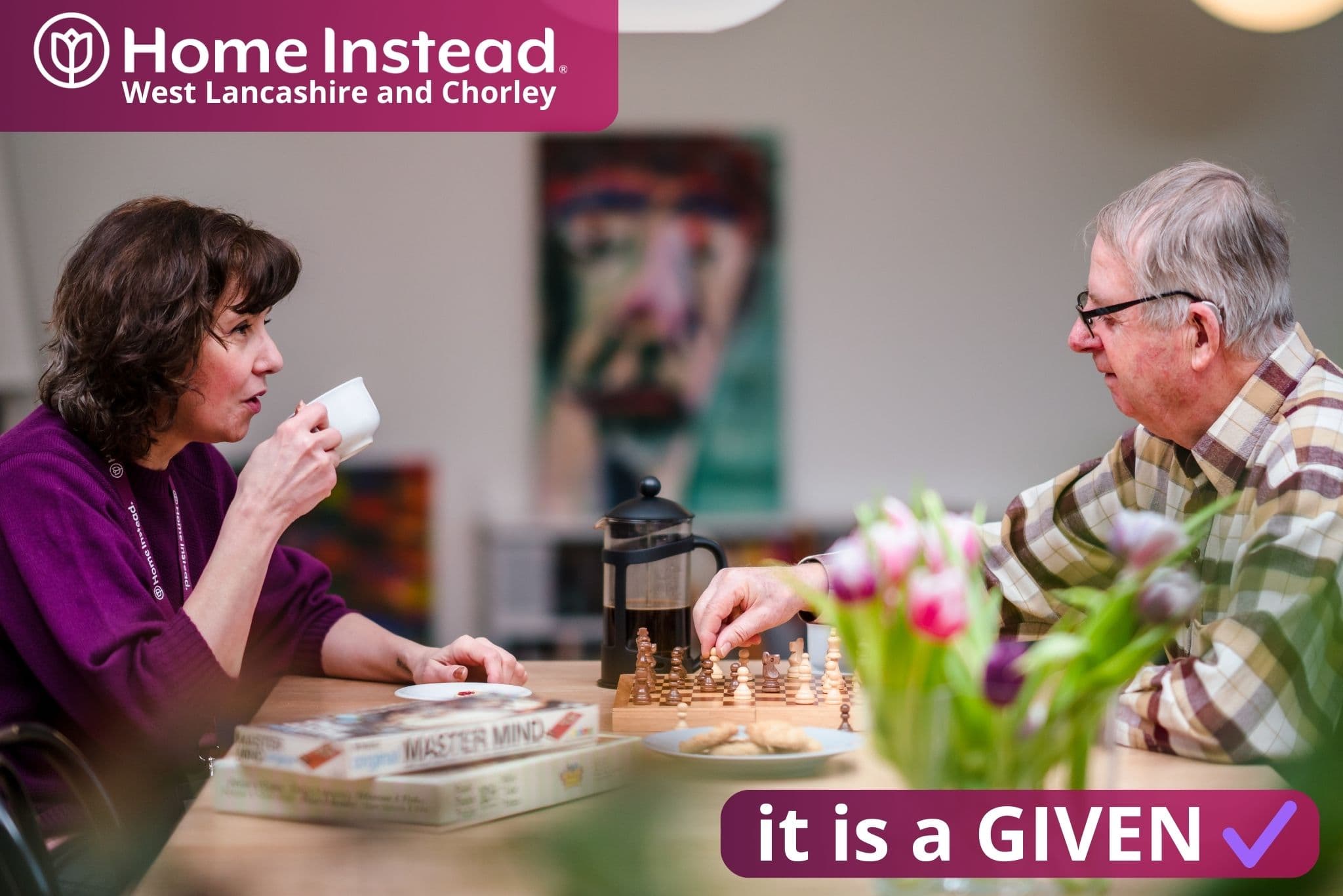 care professional and client sat together in good company, by home instead west lancashire and chorley