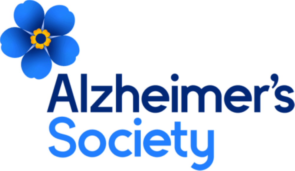 Blue flower with yellow center next to the words "Alzheimer's Society" in blue text on a white background. - Home Instead