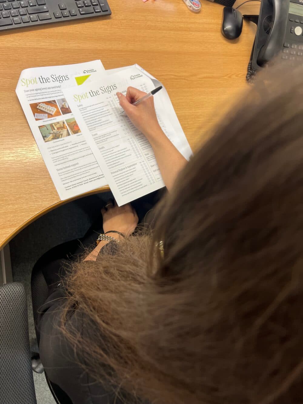 home instead Yeovil, Sherborne and Bridport team member filling spot the signs checklist