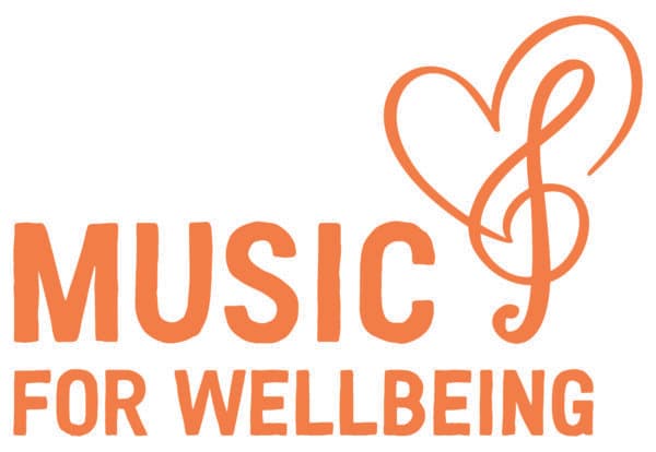 Orange text "Music for Wellbeing" with a heart-shaped treble clef symbol above the words. - Home Instead