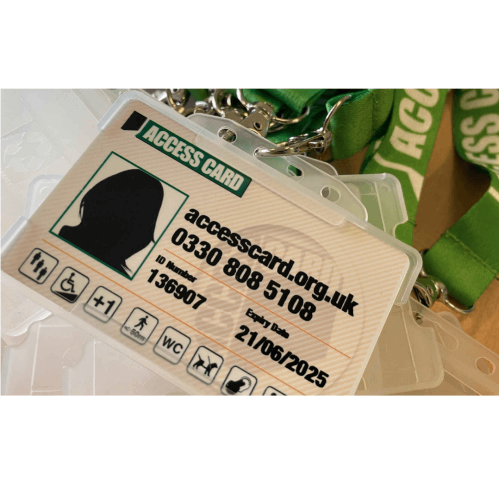 Close-up of an Access Card with contact details, icons for accessibility, and a green lanyard. - Home Instead