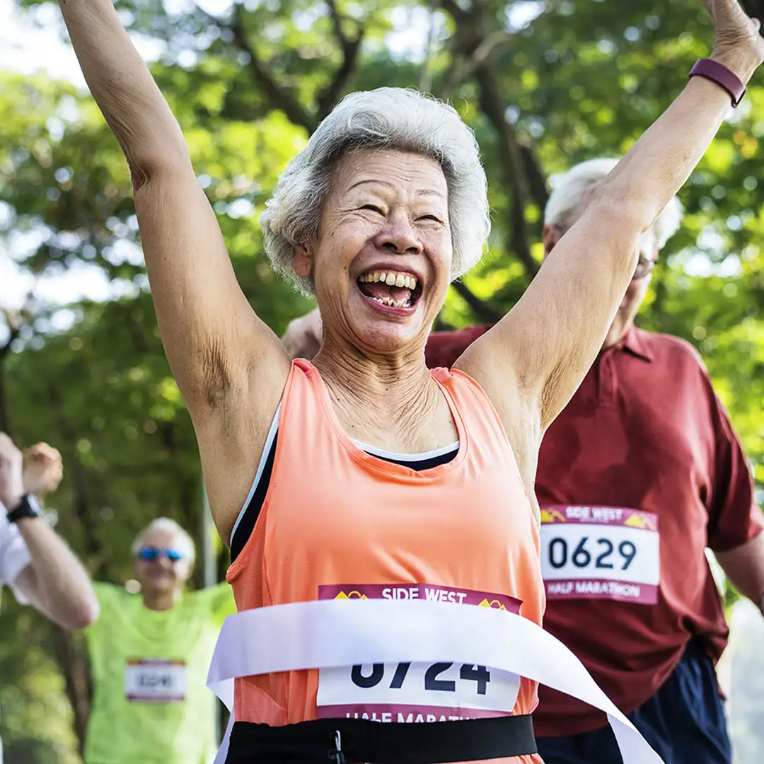 Elderly lady celebrating completion of a race