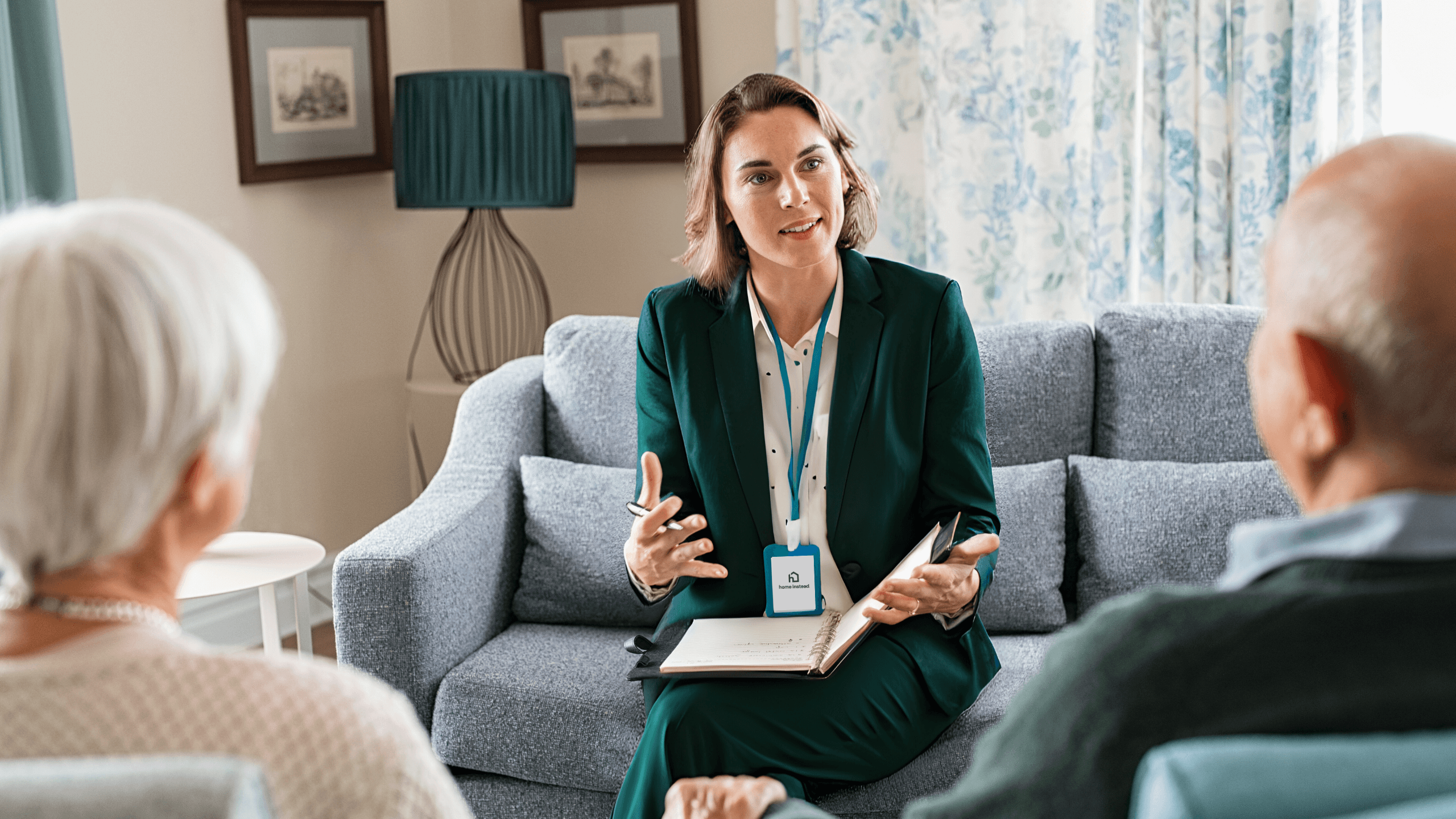 Home Care Consultation with a woman in a suit and a elderly couple