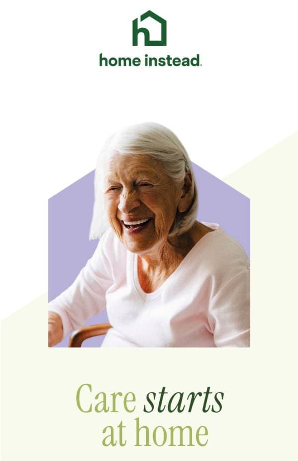 Elderly woman smiling, sitting indoors, with "Care starts at home" and Home Instead logo above her. - Home Instead