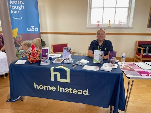 Tina sitting at a table