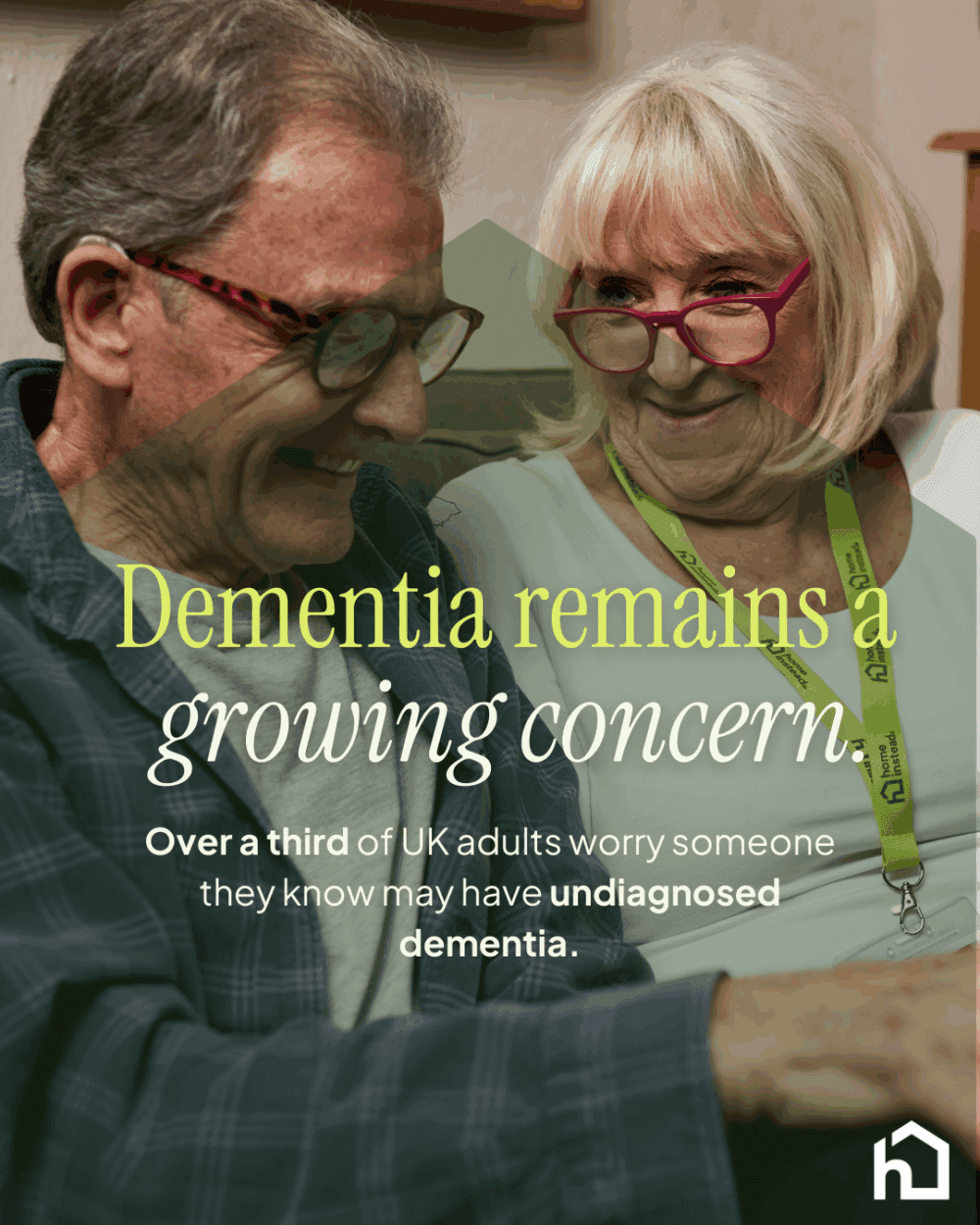 Female care pro and male client sitting on sofa and talking