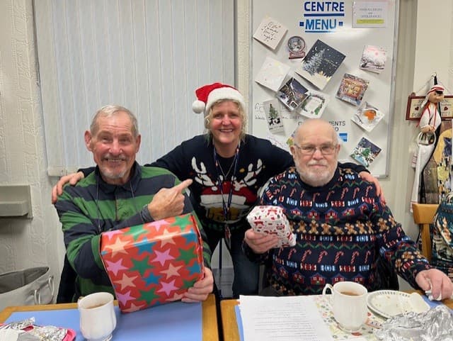 Santa makes a surprise delivery to our Companionship Cafe Christmas Party!