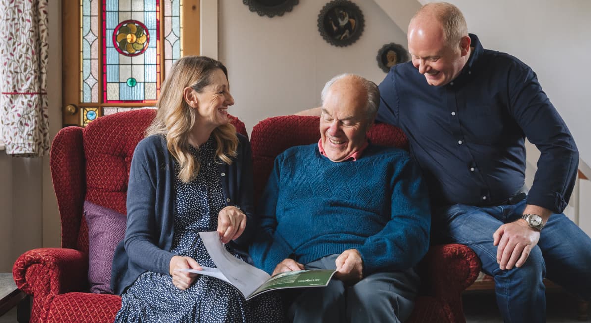 Male client with lady and man laughing and reading