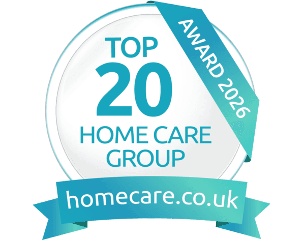 A round badge reads “Top 20 Home Care Group Award 2026, homecare.co.uk” in blue and white. - Home Instead