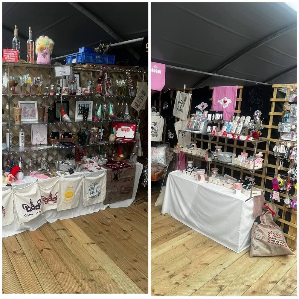 A craft market stall displaying various handmade items, including bags, decorations, and accessories on wooden shelves and tables. - Home Instead