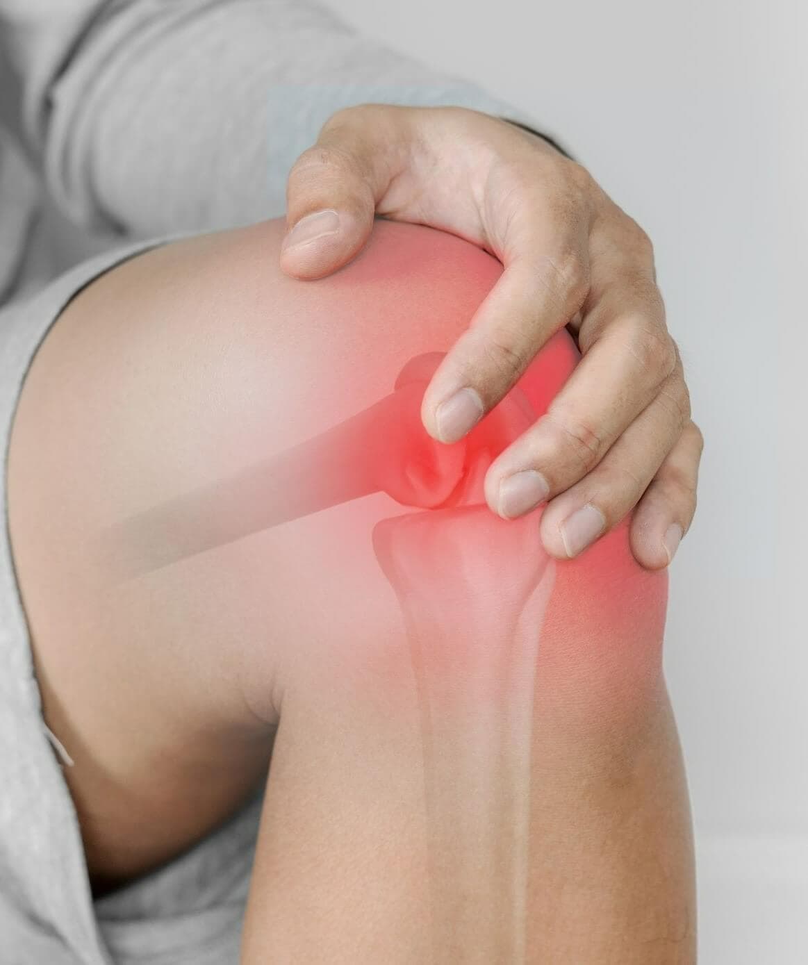 Person holding a painful knee with highlighted internal joint, indicating inflammation or injury. - Home Instead