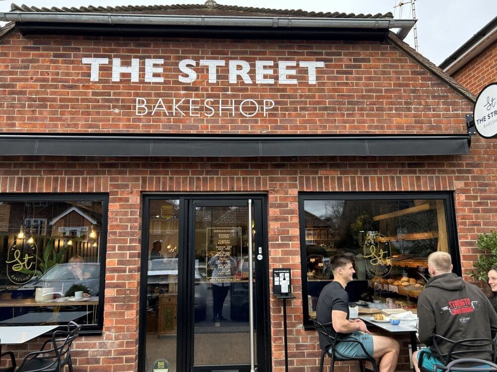 Home Instead Basingstoke picture of The Street Bakeshop, in The Street, Old Basing, Basingstoke, showing the frontage with people sitting outside enjoying their food.