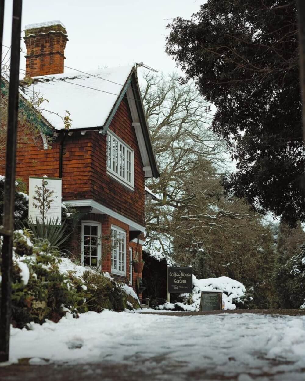 A red-brick house on edge Braintree Gardens, a sign reads "Coffee House Tease" under a tree. - Home Instead