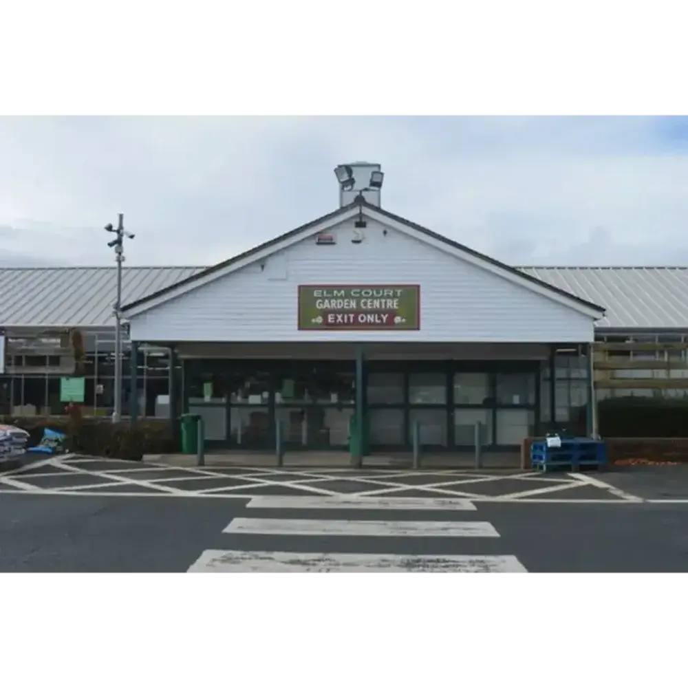 Front view of Elm Court Garden Centre building with a sign reading "Exit Only". - Home Instead