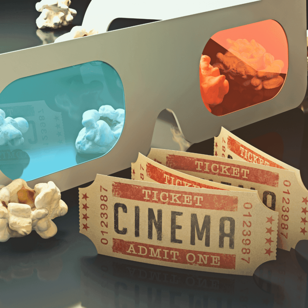 3D glasses, popcorn, and cinema tickets arranged together against a dark background. - Home Instead