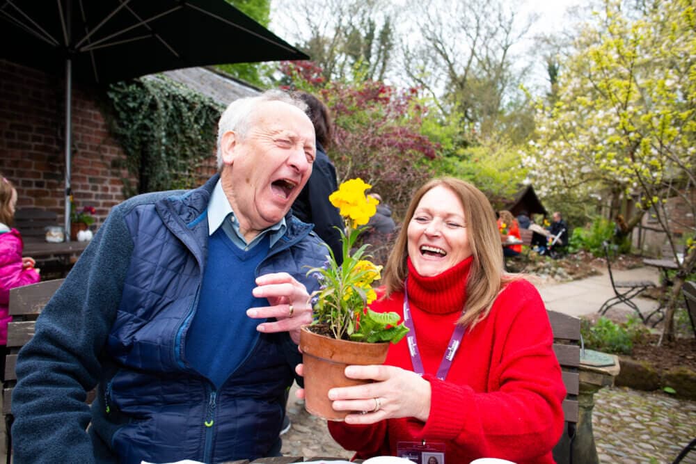 Home Instead Care Professional on a visit outdoors with a client.
