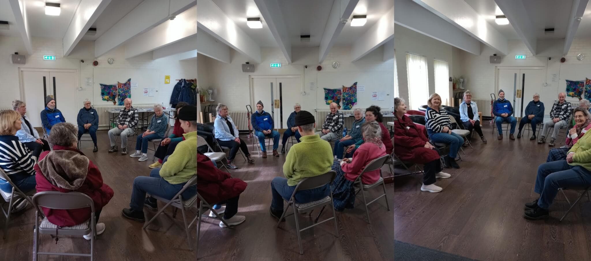 A group of people sitting in a circle in a brightly lit room with wooden floors and colorful artwork on the walls. - Home Instead