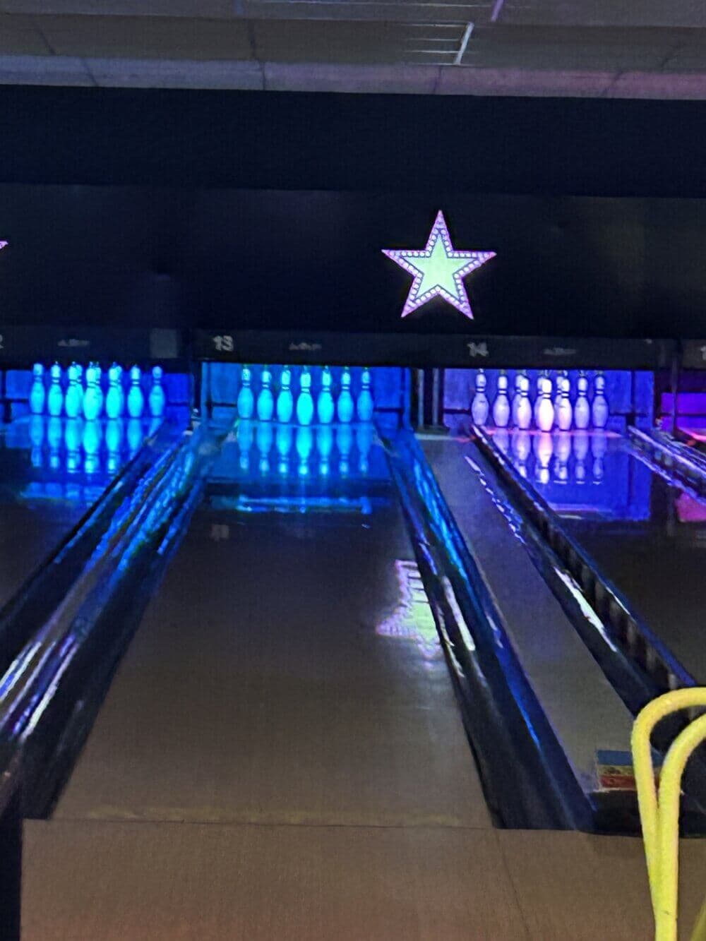 Home Instead Basingstoke picture of bowling lanes with the skittles set up at the end at Hollywood 10-Pin bowling in Basingstoke