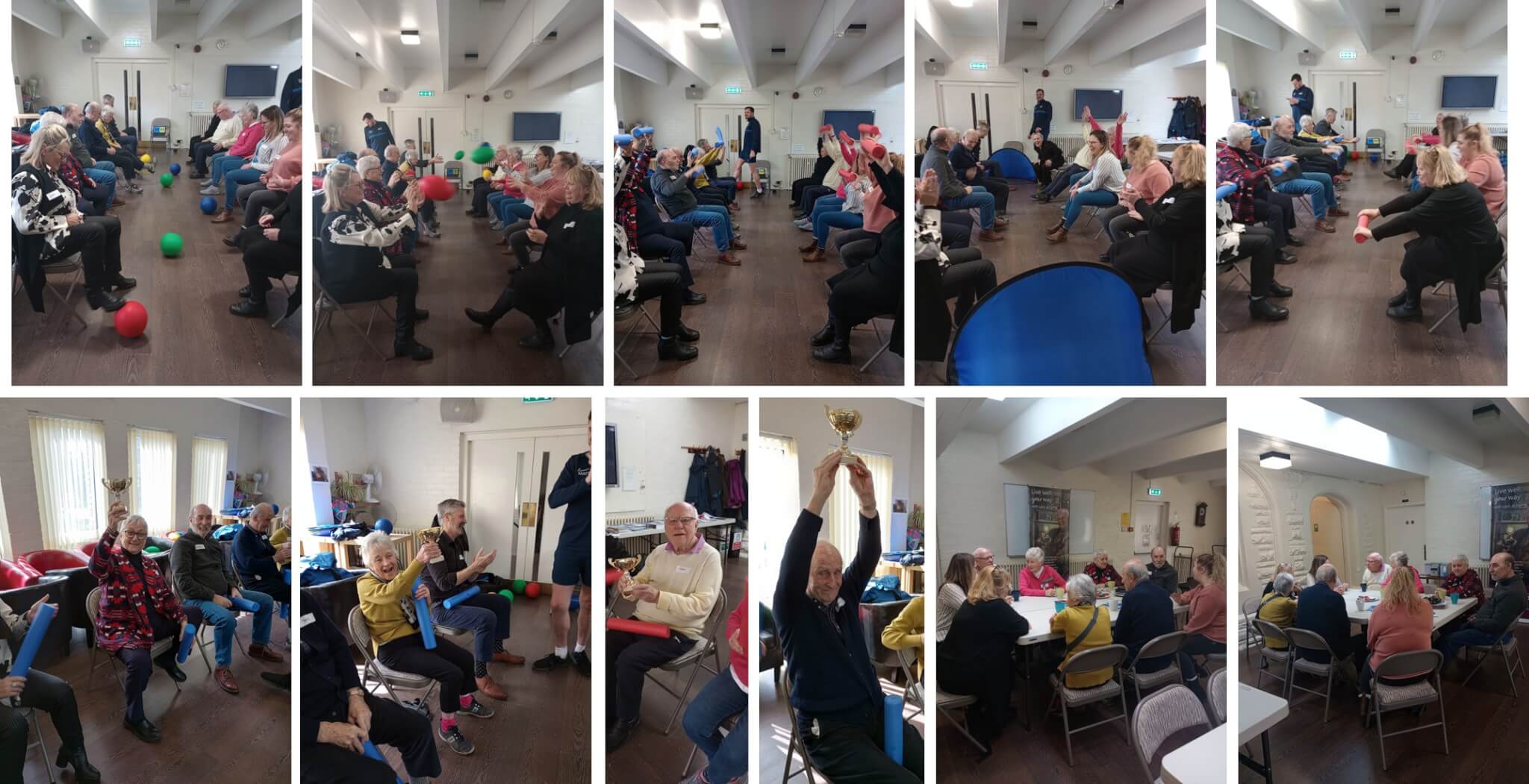 A group of elderly people participating in indoor exercises and activities, some are holding trophies and enjoying the moments. - Home Instead