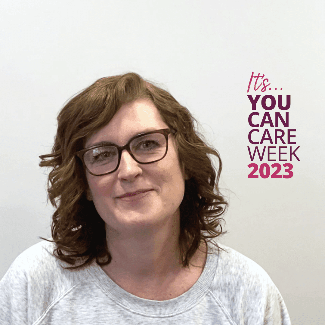 A person with glasses and curly hair smiling, text reads "It's You Can Care Week 2023" on the right. - Home Instead