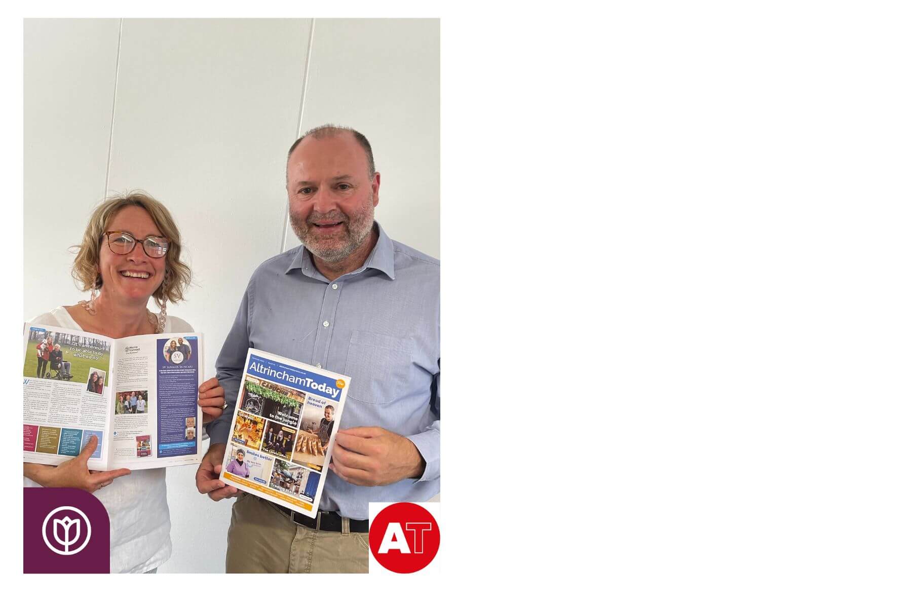 Two people smiling and holding copies of "Altrincham Today" magazine, standing against a white background. - Home Instead