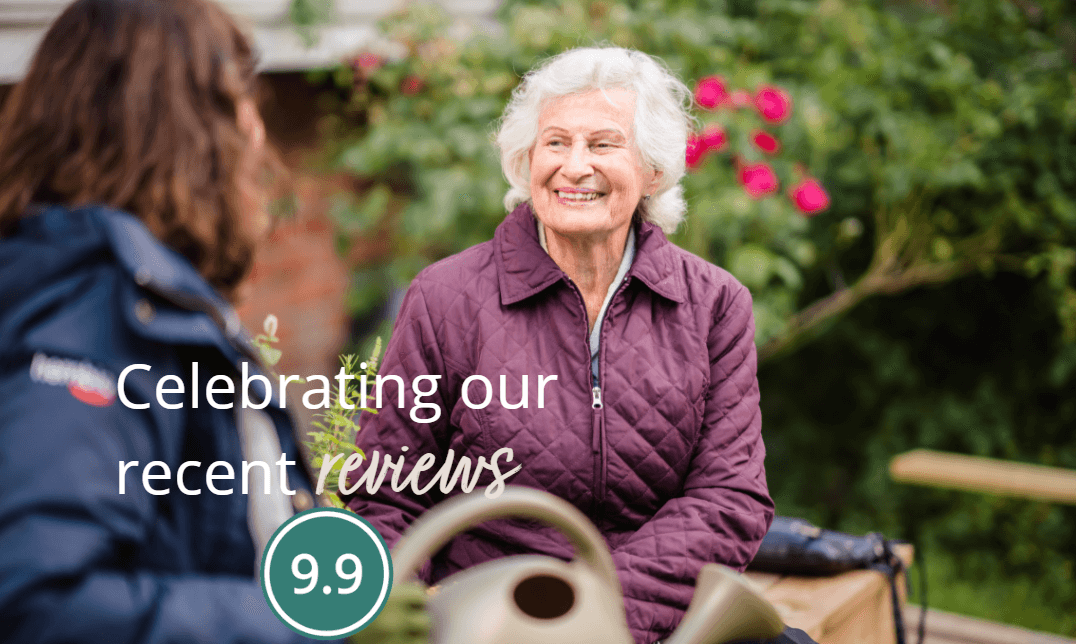 Two people sitting outside, one elderly and smiling. Text reads "Celebrating our recent reviews" with a circular "9.9" badge. - Home Instead