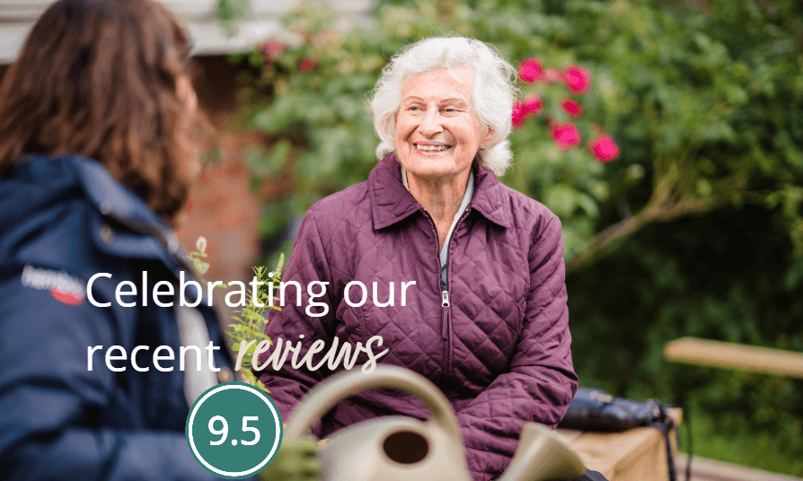 Elderly woman smiling at another person outdoors, text reads "Celebrating our recent reviews 9.5". - Home Instead