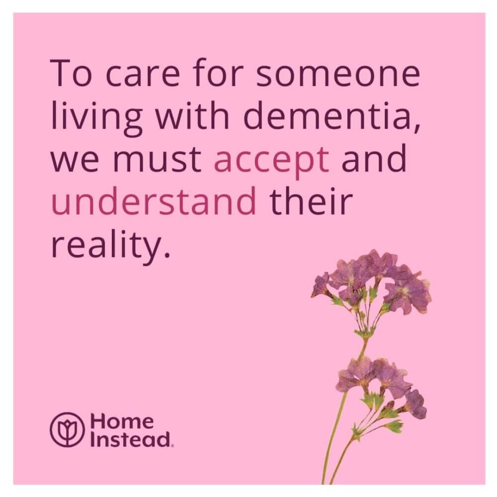Text on pink background: "To care for someone living with dementia, we must accept and understand their reality." Flowers included. - Home Instead