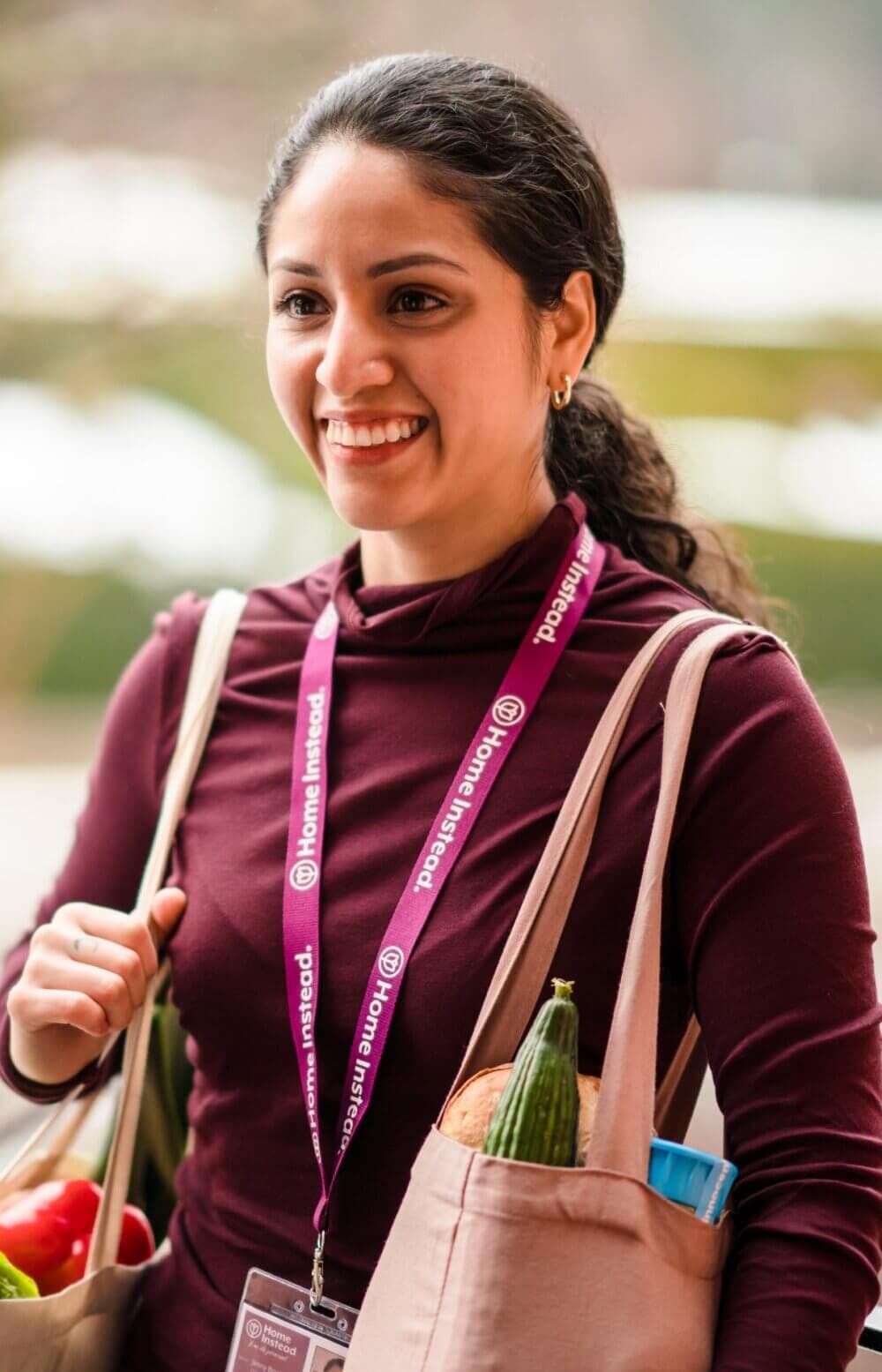 Home Instead Poole Care Professional giving a helping hand to client