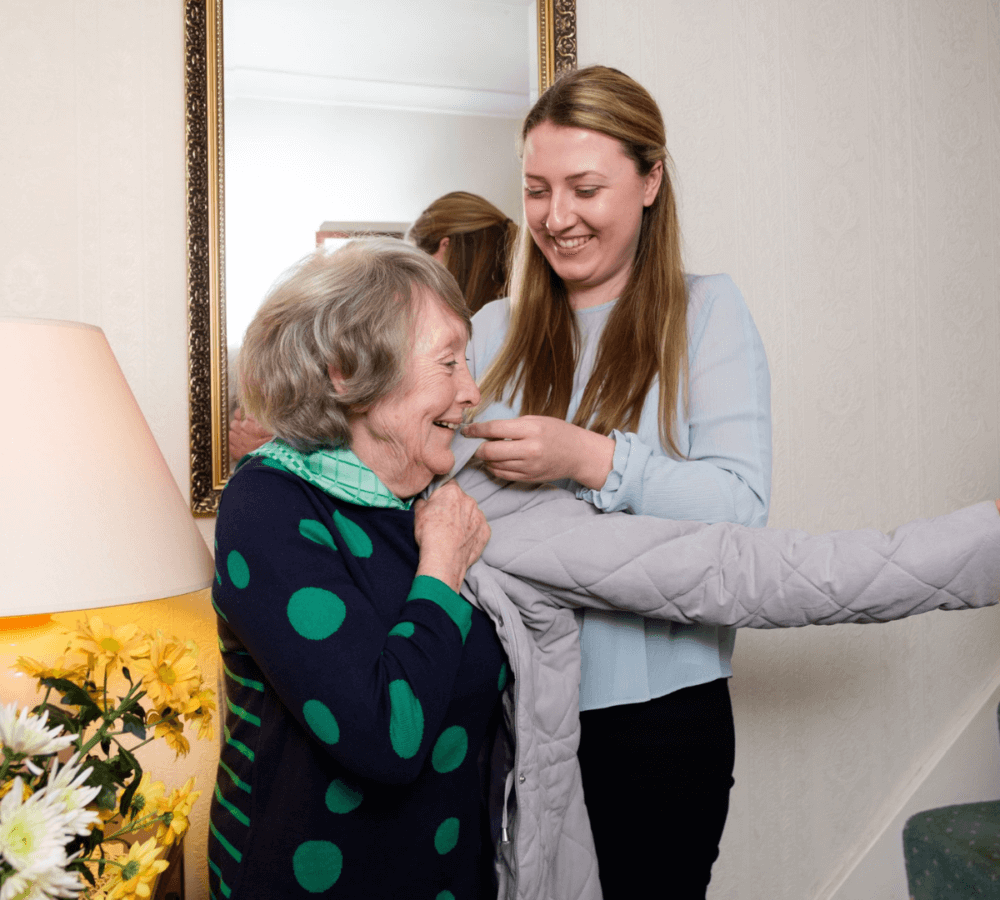 Home Instead Poole Care Professional helping client