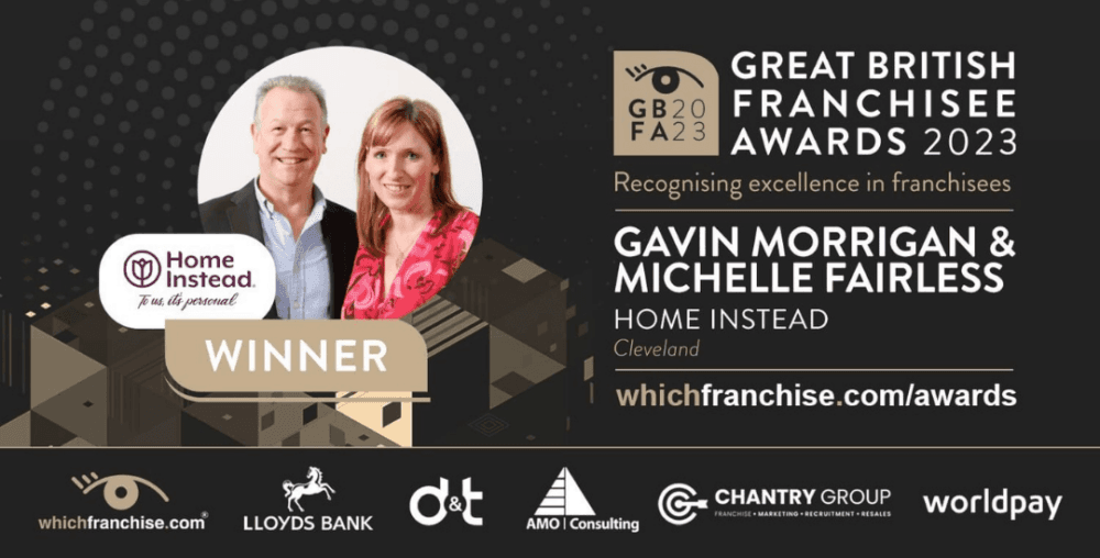 Award banner for "Great British Franchisee Awards 2023," featuring winners Gavin Morrigan & Michelle Fairless from Home Instead. - Home Instead