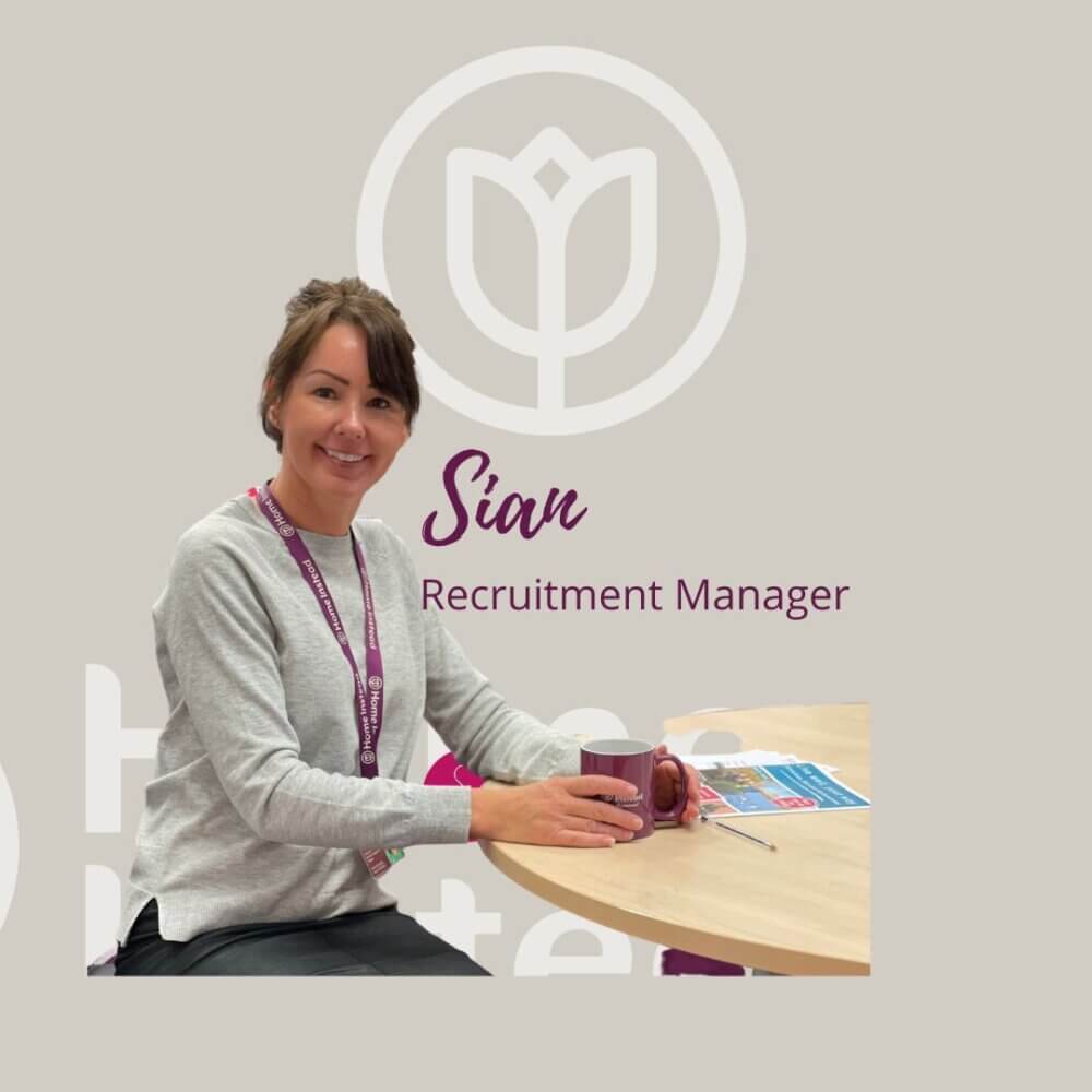 Woman in gray sweater at a table with a mug, labeled "Sian, Recruitment Manager," logo and brochures in the background. - Home Instead
