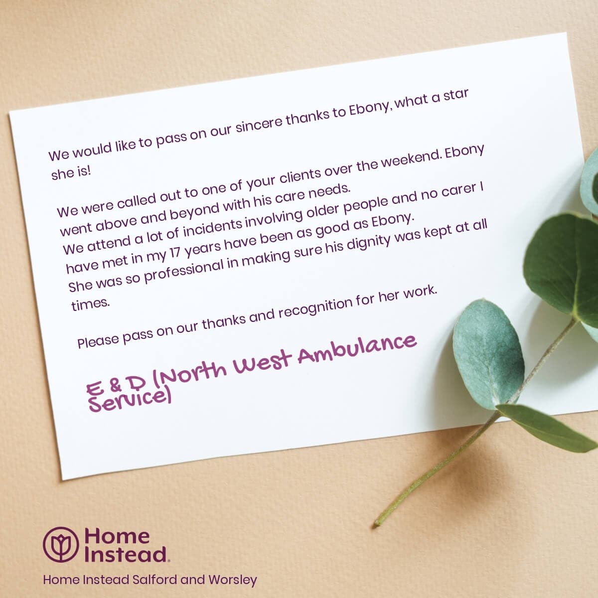 A thank you card praising an employee named Ebony for her outstanding care services, placed on a table with a leaf. - Home Instead