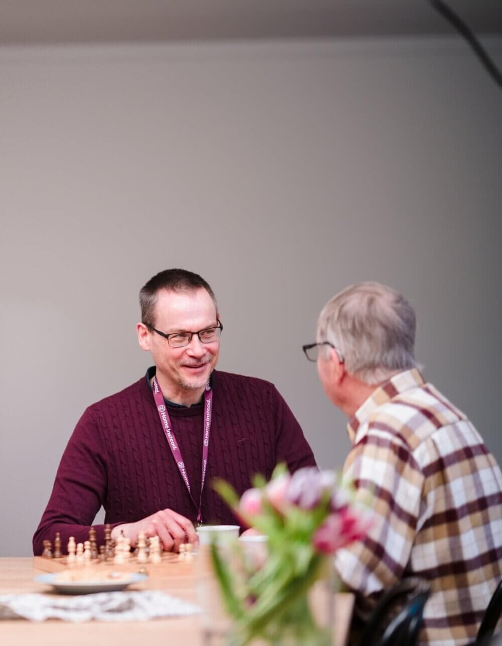 Home Instead Bournemouth & Christchurch Care Professional laughing with client